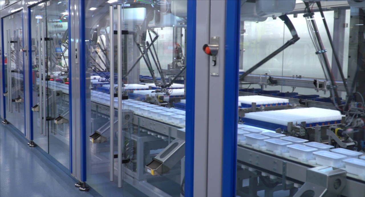 image of an ophthalmic manufacturing production line with products being produced